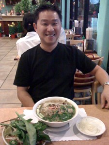 Cuong with pho bo (beef pho) at Pho Vie II